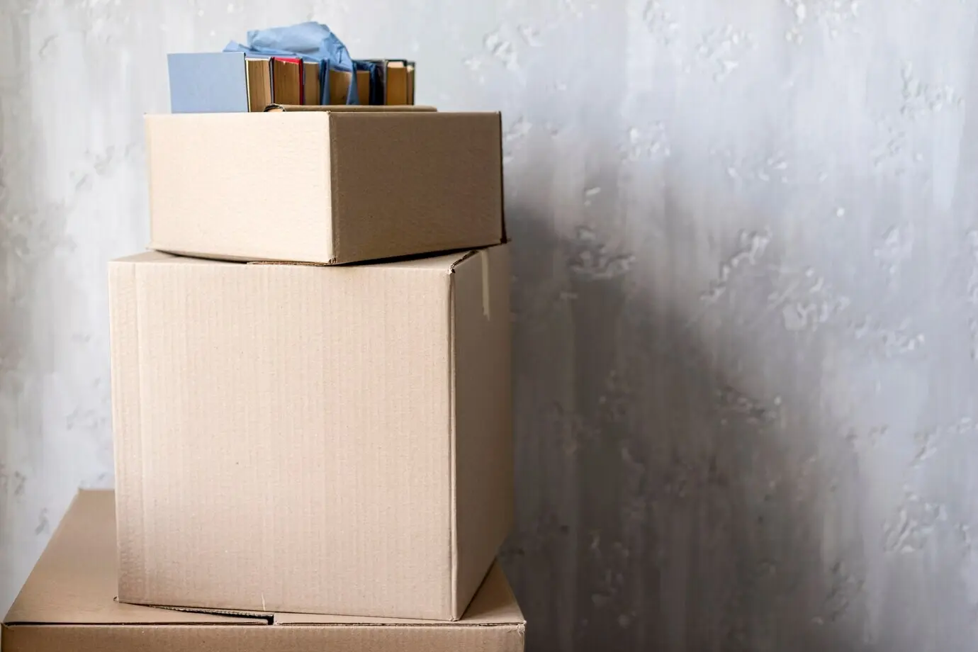 Front-facing view of boxes for moving out with copy space